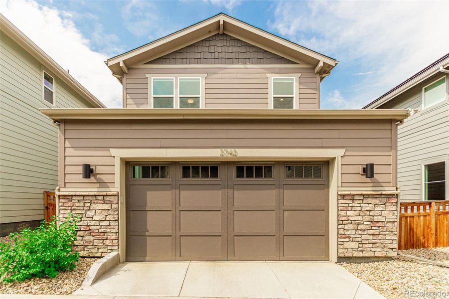 Front exterior of a new home in Arras Park, Thornton, CO, highlighting curb appeal (Image 18).