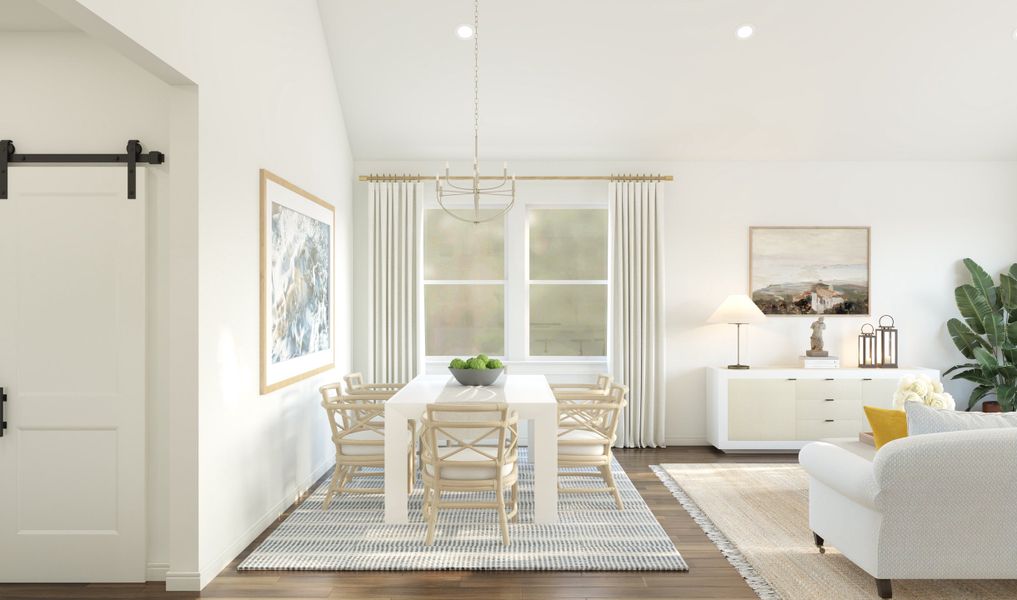 Dining area with vaulted ceiling and chandelier