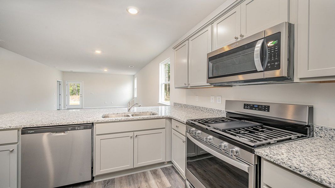 Representative furnished interior of a home built from the HELENA by D.R. Horton in Lochaven, Conway (Image 5).