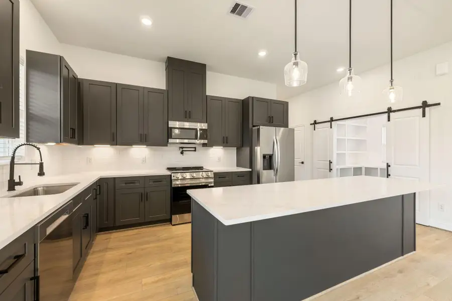 Furnished interior view inside a new home in Spring Branch Crossing, Conroe (Image 3).