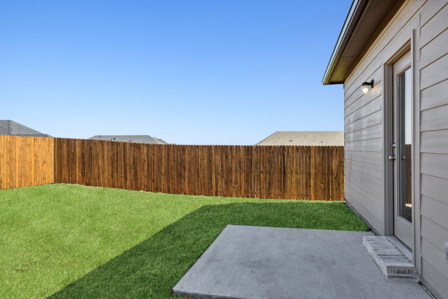 Back Yard in the Ash home plan by Trophy Signature Homes – REPRESENTATIVE PHOTO