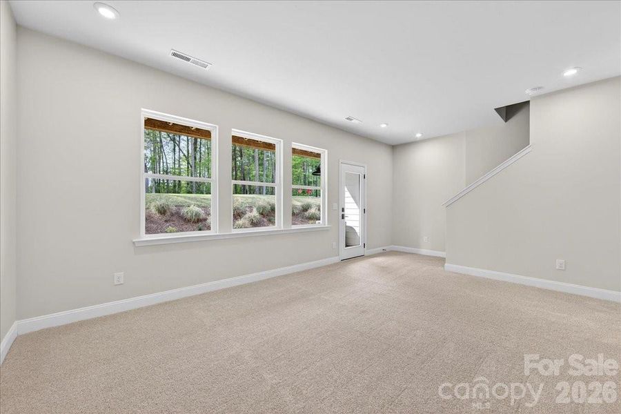 Light filled first floor flex space with access to the covered outdoor living