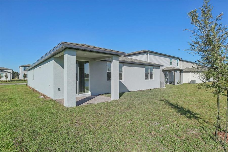 Exterior details and patio area of a home in The Reserve at Twin Lakes, St. Cloud (Image 24).