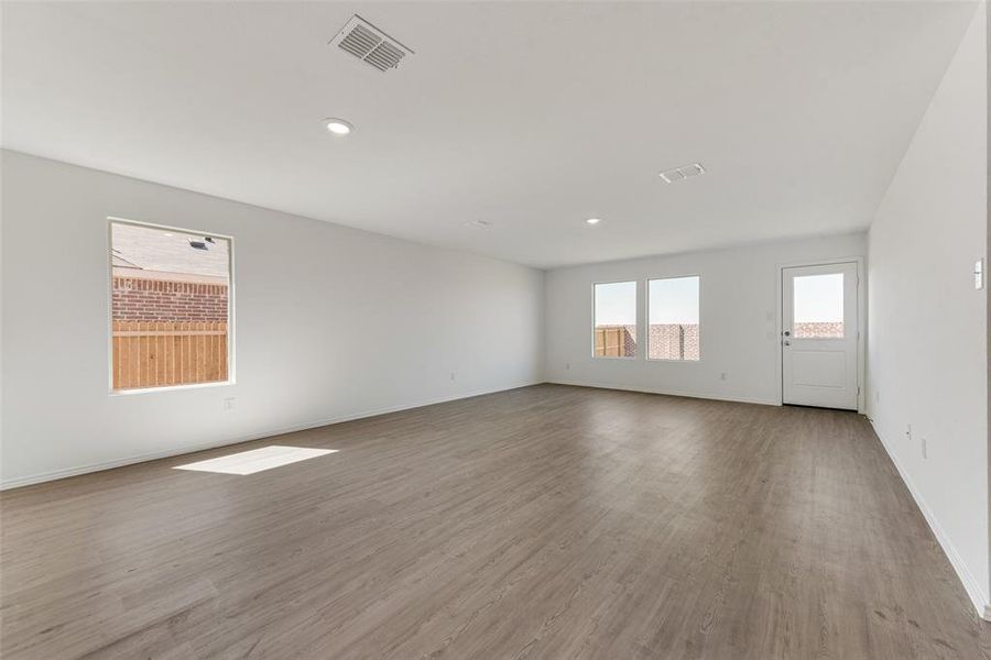 Unfurnished room with light hardwood / wood-style floors