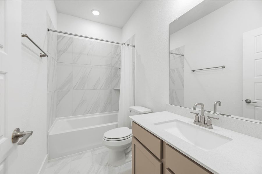 Downstairs full bathroom near the guest bedroom.