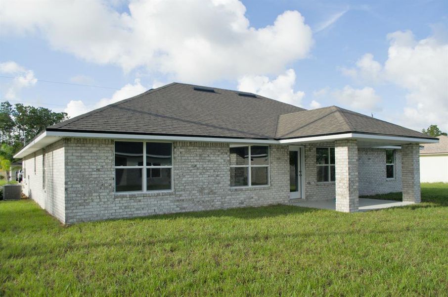 Exterior details and patio area of a home in Palm Coast, Palm Coast (Image 2).