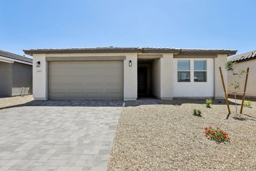 Representative exterior photo of a completed home built from the Lilac by Ashton Woods in Visara, Surprise, AZ (Image 2). Representative exterior photo of a completed home built from the Lilac by Ashton Woods in Visara, Surprise, AZ (Image 2).