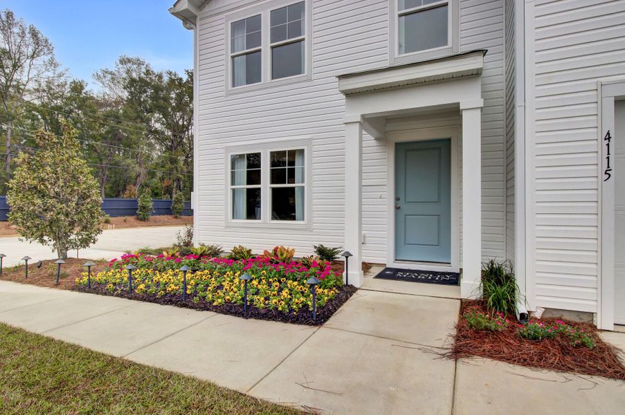 Exterior details and patio area of a home in Essence at Elms Glen Single Family Homes, Ladson (Image 21).