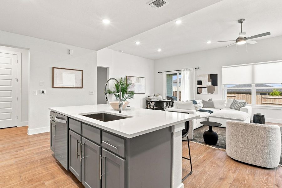Oversized kitchen island featuring LOF400 single-bowl stainless steel sink, Antoni chrome faucet, and seating for casual dining. Oversized kitchen island featuring LOF400 single-bowl stainless steel sink, Antoni chrome faucet, and seating for casual dining.