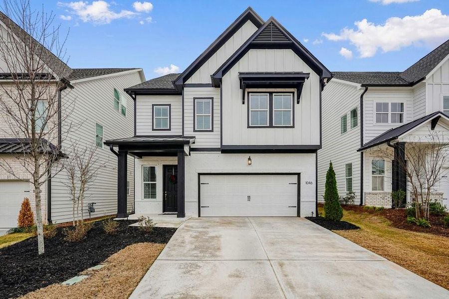 Front exterior of a new home in , Canton, GA, highlighting curb appeal (Image 1). Front exterior of a new home in , Canton, GA, highlighting curb appeal (Image 1).