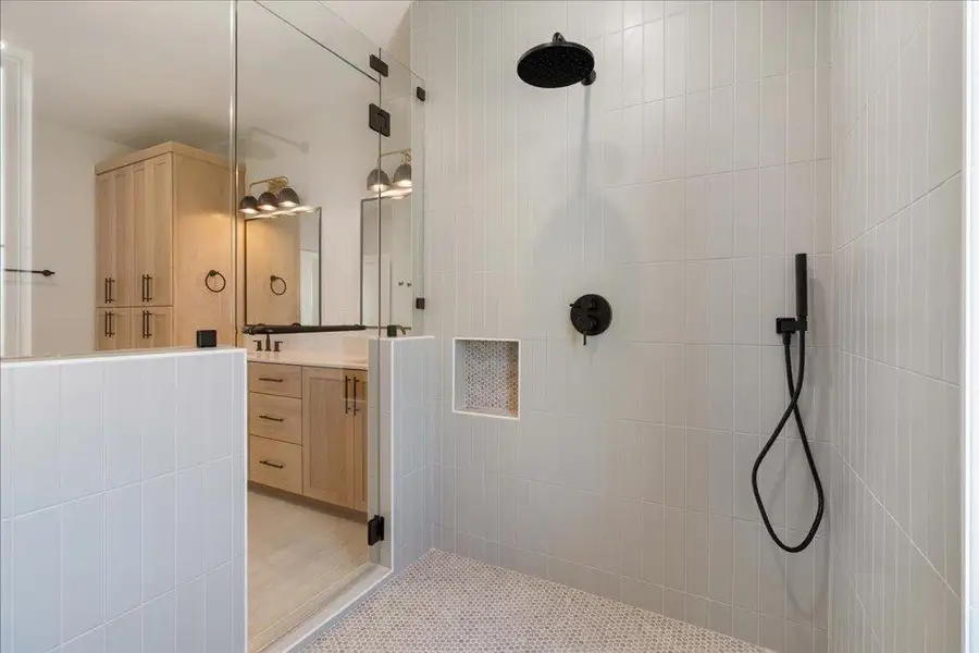 Full bath with vanity and a walk in shower