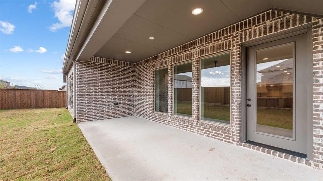 Exterior details and patio area of a home in North Sky 55', Celina (Image 4).