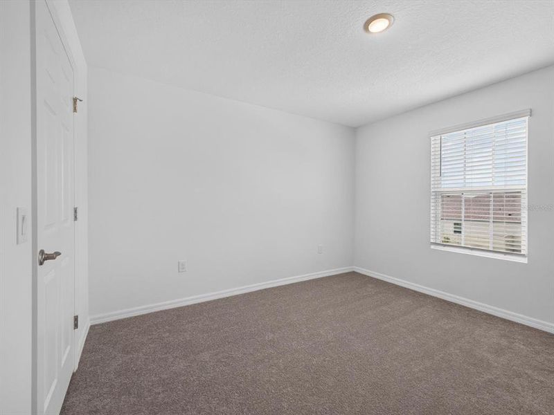 Spacious, unfurnished interior of a new home in Storey Creek, Kissimmee (Image 27).