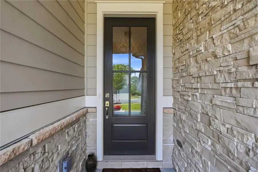 Exterior details and patio area of a home in The Retreat at Sterling on the Lake 48', Flowery Branch (Image 24).
