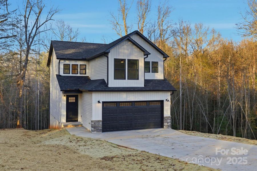 Front exterior of a new home in , Hickory, NC, highlighting curb appeal (Image 15).