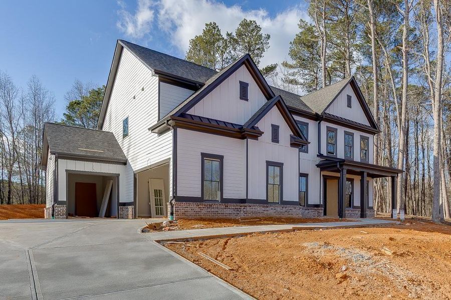 Front exterior of a new home in , Cumming, GA, highlighting curb appeal (Image 1). Front exterior of a new home in , Cumming, GA, highlighting curb appeal (Image 1).