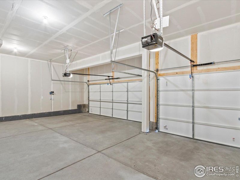 Three car garage is fully insulated, has openers and is ready for your toys!