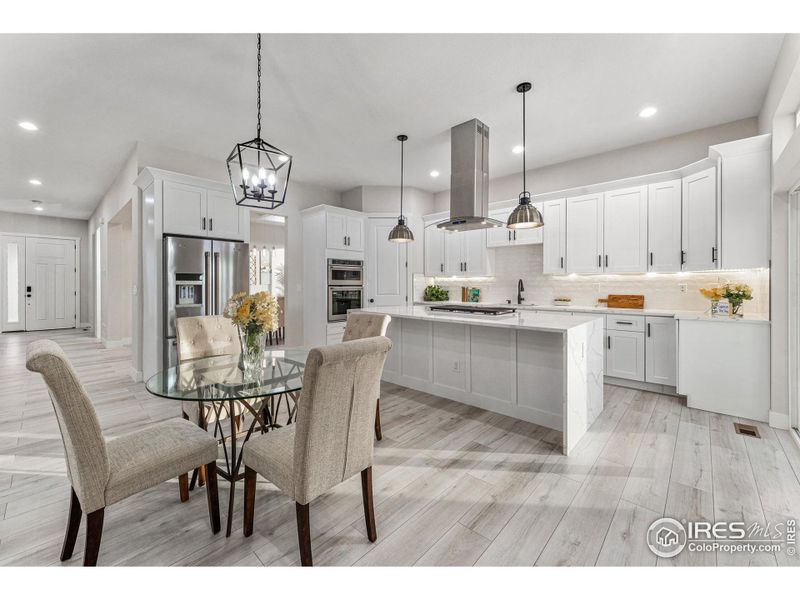 Spacious island with quartz waterfall counter top.