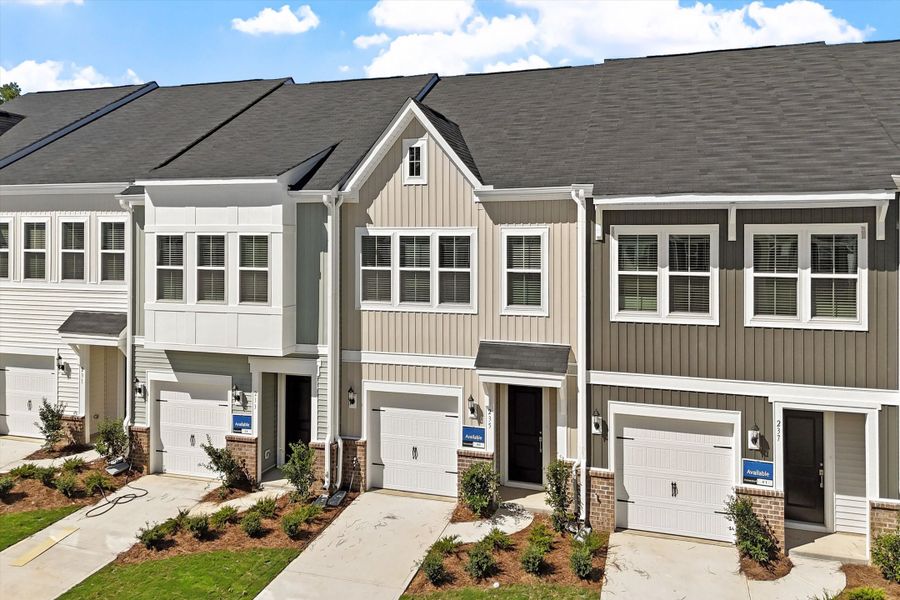 Front exterior of a new home in West Main Townhomes, Sanford, NC, highlighting curb appeal (Image 2). Front exterior of a new home in West Main Townhomes, Sanford, NC, highlighting curb appeal (Image 2).
