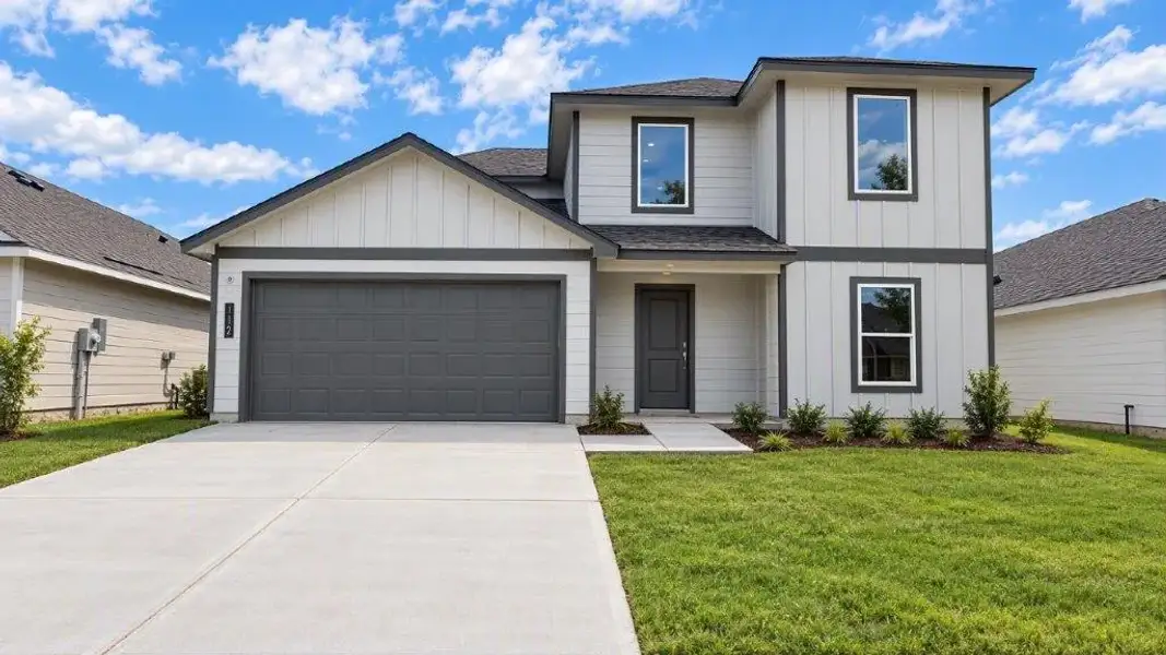 Front exterior of a new home in Fisher's Cove, Aransas Pass, TX, highlighting curb appeal (Image 1). Front exterior of a new home in Fisher's Cove, Aransas Pass, TX, highlighting curb appeal (Image 1).