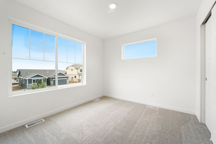Spacious, unfurnished interior of a new home in Union Colony West, Greeley (Image 13).