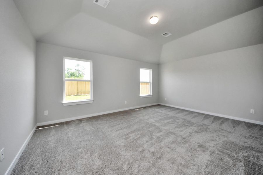 Another perspective unveils a comprehensive view of the serenity and comfort this primary suite offers. Sample photo of completed home with similar floor plan. Actual colors and selections may vary. Another perspective unveils a comprehensive view of the serenity and comfort this primary suite offers. Sample photo of completed home with similar floor plan. Actual colors and selections may vary.