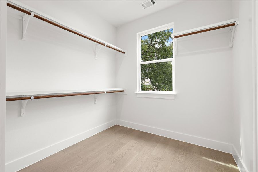 Primary walk-in closet Primary walk-in closet