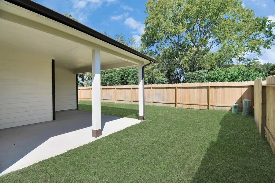 Experience outdoor living at its finest on this expansive covered patio, thoughtfully designed for BBQs and delightful outdoor dining. Sample photo of completed home with similar floor plan. Actual colors and selections may vary. Experience outdoor living at its finest on this expansive covered patio, thoughtfully designed for BBQs and delightful outdoor dining. Sample photo of completed home with similar floor plan. Actual colors and selections may vary.