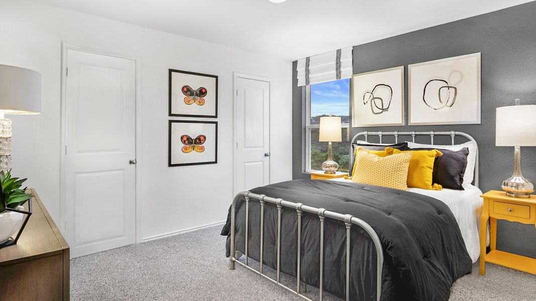 Carpeted bedroom featuring baseboards