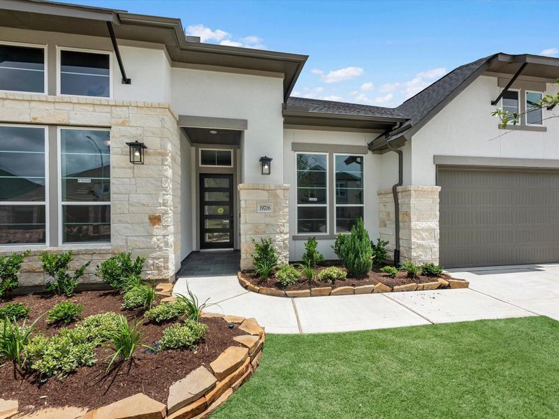 Exterior details and patio area of a home in Dunham Pointe, Cypress (Image 3). Exterior details and patio area of a home in Dunham Pointe, Cypress (Image 3).