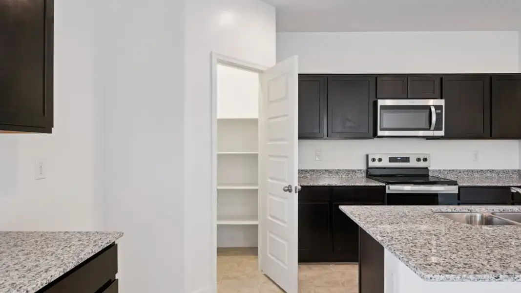 Furnished interior view inside a new home in Magma Ranch Vistas, Florence (Image 8).
