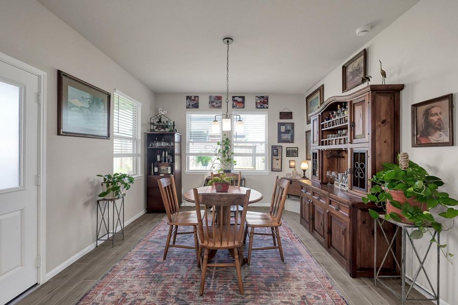 Breakfast room. This space could easily accommodate a larger dining table if desired!
