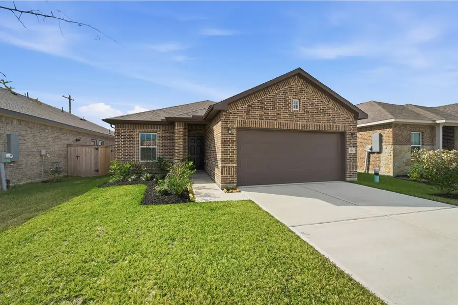 Front exterior of a new home in Windrose Green, Angleton, TX, highlighting curb appeal (Image 2).