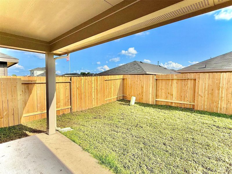 Covered patio provides shade and protection from the elements—perfect for relaxing and everyday outdoor entertaining.