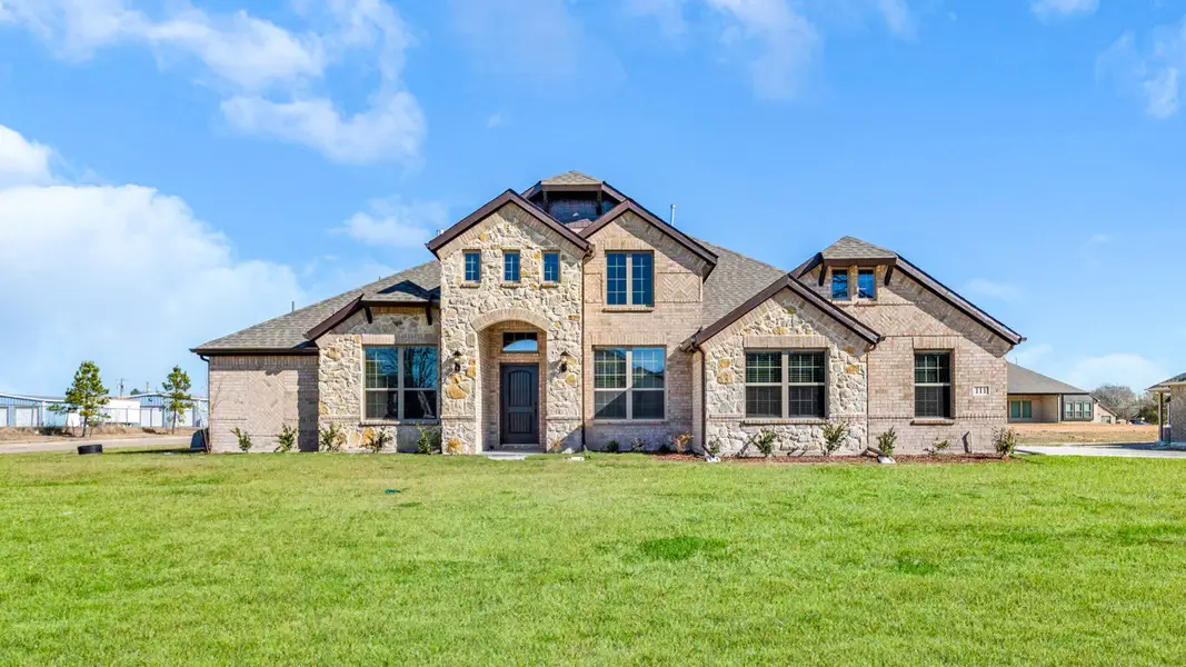 Front exterior of a new home in Lakeview Estates, Canton, TX, highlighting curb appeal (Image 1). Front exterior of a new home in Lakeview Estates, Canton, TX, highlighting curb appeal (Image 1).