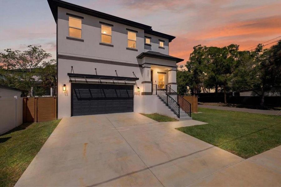 Front exterior of a new home in , Tampa, FL, highlighting curb appeal (Image 26).
