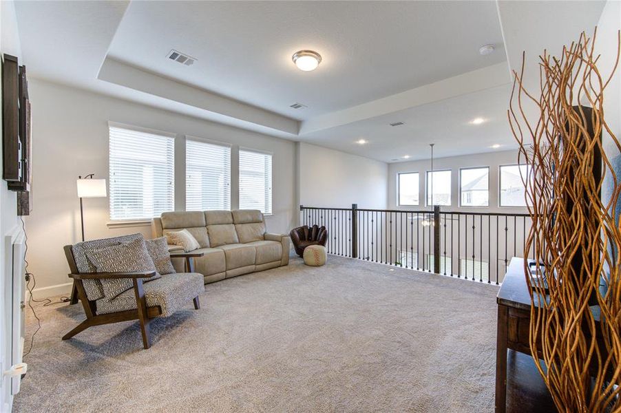 Expansive second-floor game room offers endless entertainment possibilities.