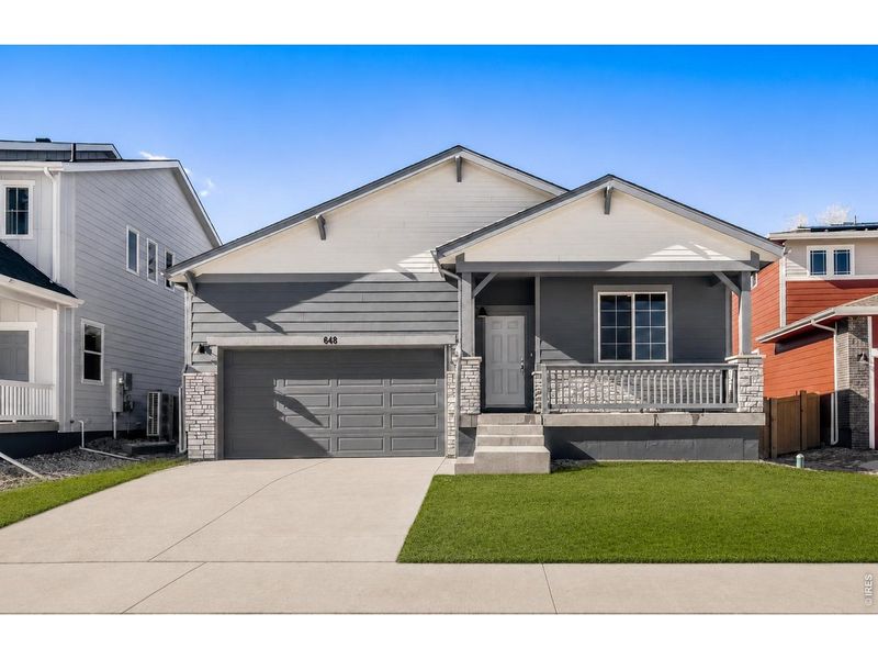 Front exterior of a new home in Trevenna, Windsor, CO, highlighting curb appeal (Image 2). Front exterior of a new home in Trevenna, Windsor, CO, highlighting curb appeal (Image 2).