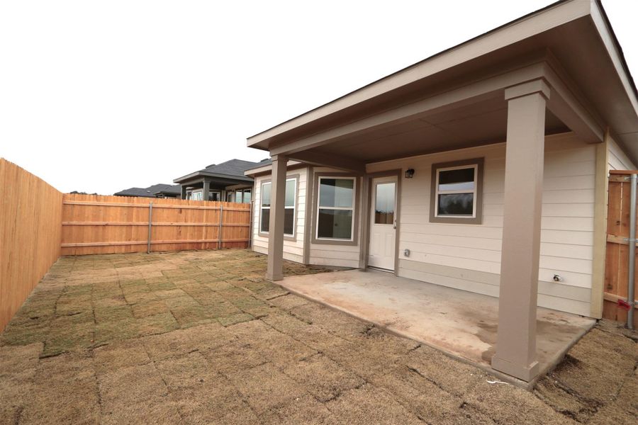 Rear view of house featuring a patio area