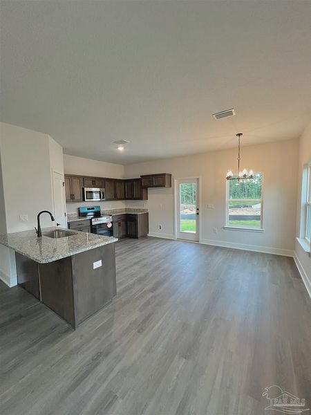 Furnished interior view inside a new home in Pine Top, Cantonment (Image 4).