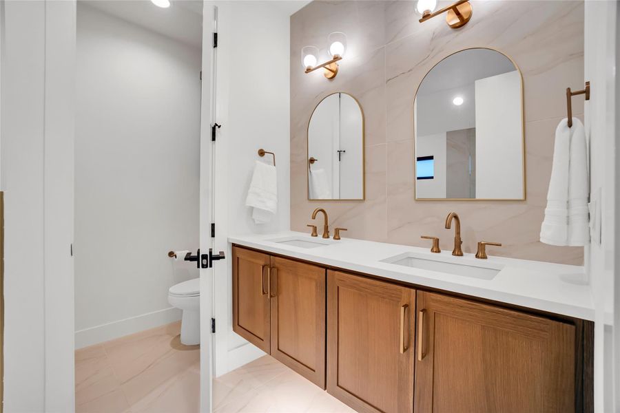 Bathroom featuring double vanity and recessed lighting Bathroom featuring double vanity and recessed lighting