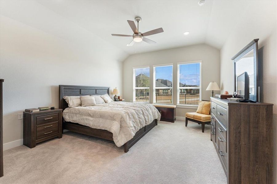 Primary bedroom with large windows for natural light