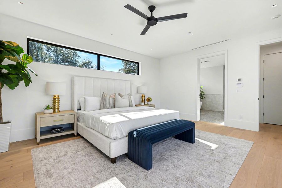 Bedroom with light wood-type flooring and ceiling fan