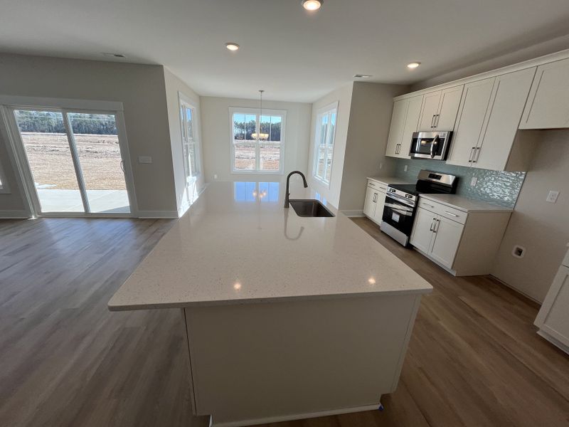 Furnished interior view inside a new home in River Tide Farms, Bolivia (Image 6).