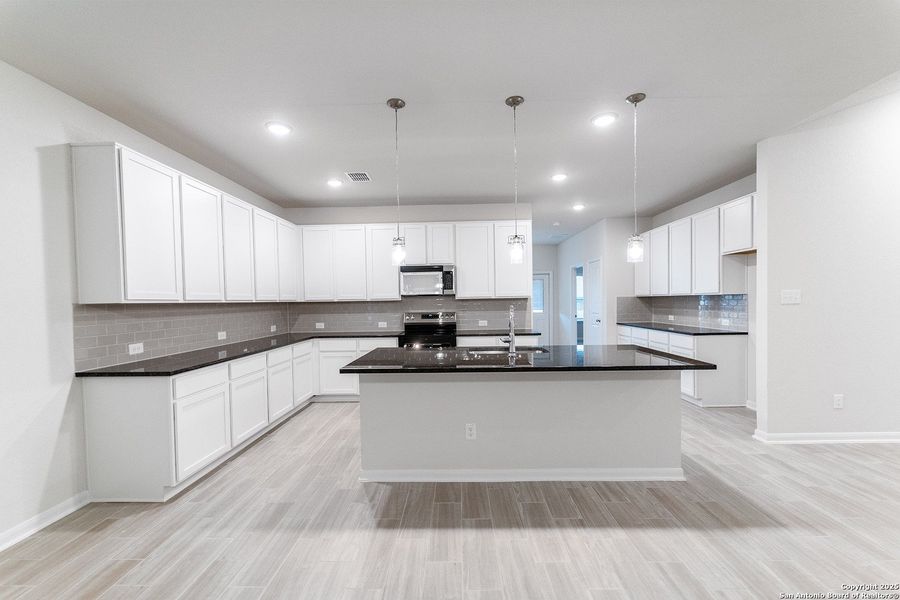 Furnished interior view inside a new home in Laurel Vistas, San Antonio (Image 2).