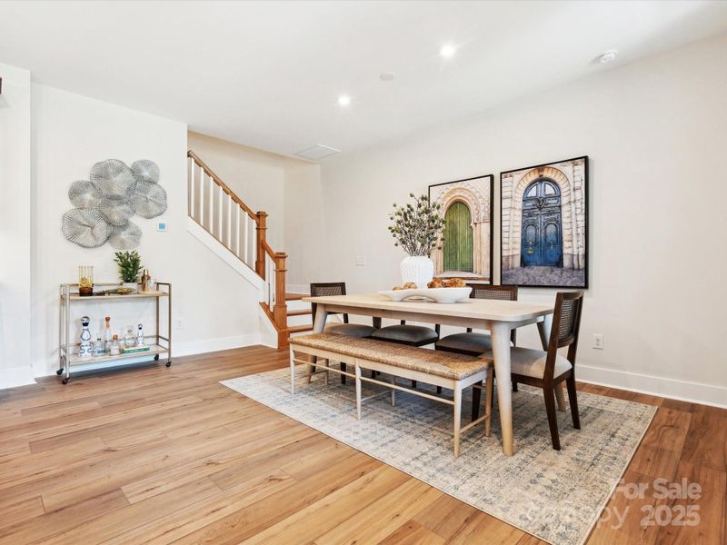 Dining space highlighted by open rail opening up the space. *Model Photos | Actual finishes, structural selections, and orientation may vary.