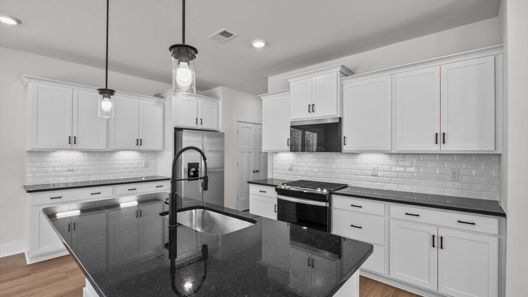 Representative furnished interior of a home built from the Jasmine by DRB Homes in Harrier Point, Woodruff (Image 7).