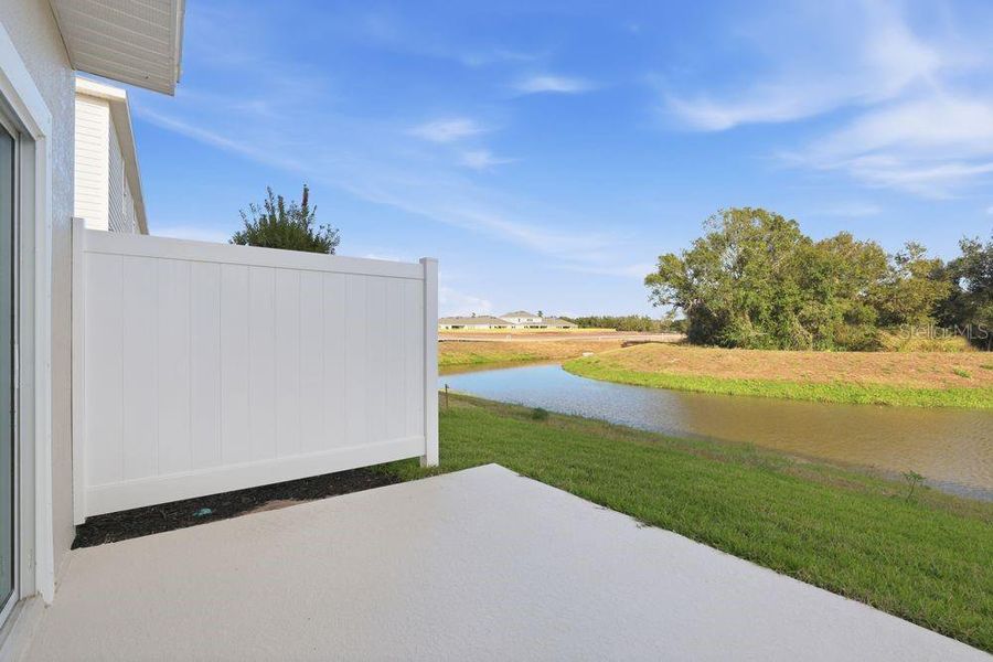 Exterior details and patio area of a home in The Towns at Firethorn, Parrish (Image 3).