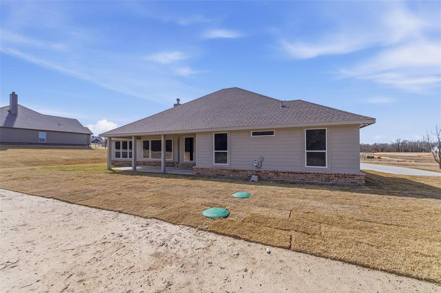 Exterior details and patio area of a home in Oak Grove Addition, Springtown (Image 19).