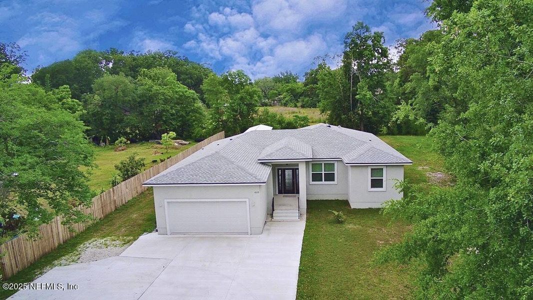 Front exterior of a new home in , Jacksonville, FL, highlighting curb appeal (Image 1).